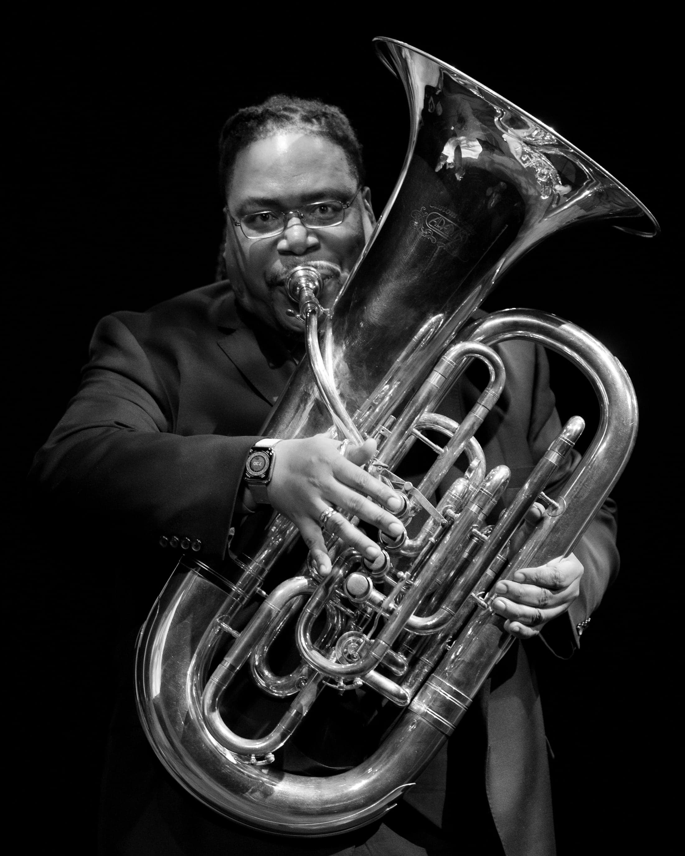 Black and white portrait of a brass musician